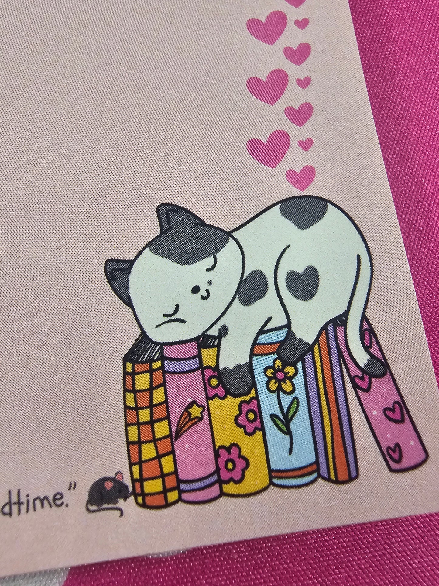 Cartoon dogs with books on a pink background