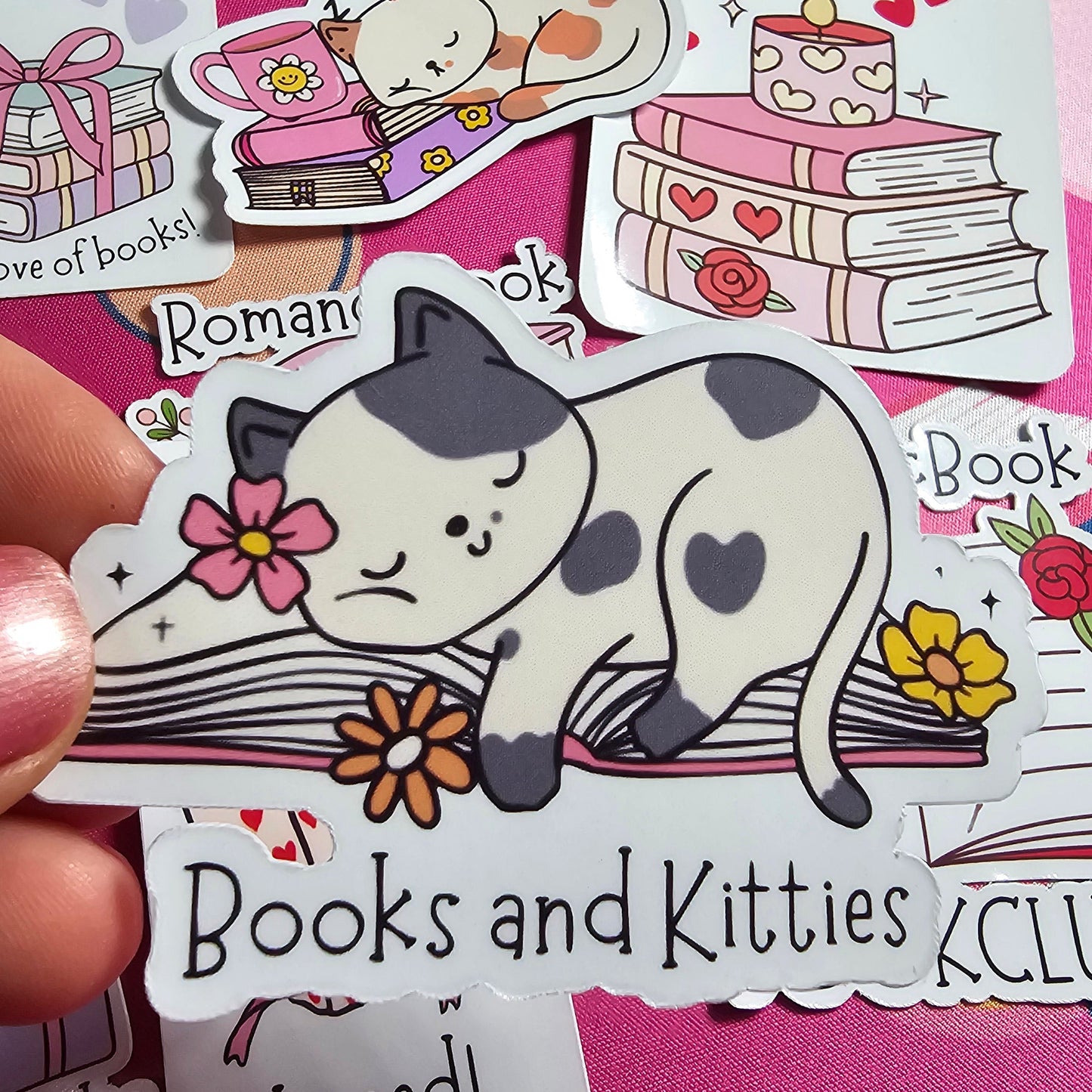 Stickers with dogs, books, and text on a pink background