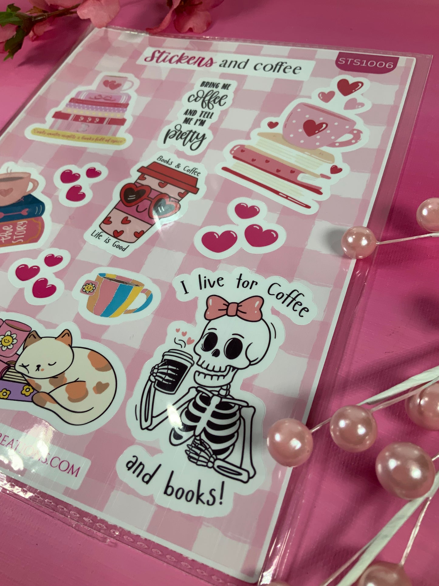 Sheet of stickers with coffee-themed designs on a pink background
