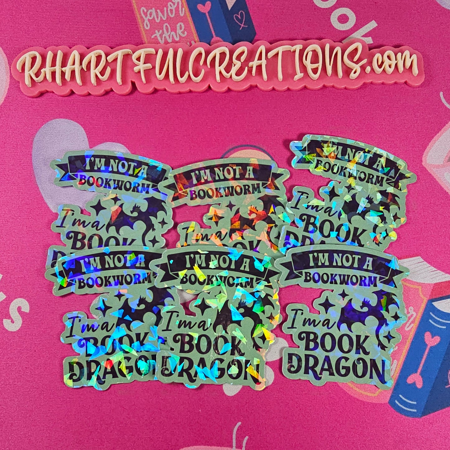 “I’m Not a Bookworm, I’m a Book Dragon” holographic vinyl sticker with rainbow sparkle finish, handmade by RH Artful Creations.