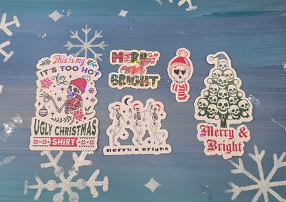Set of Christmas-themed stickers on a blue background with snowflakes