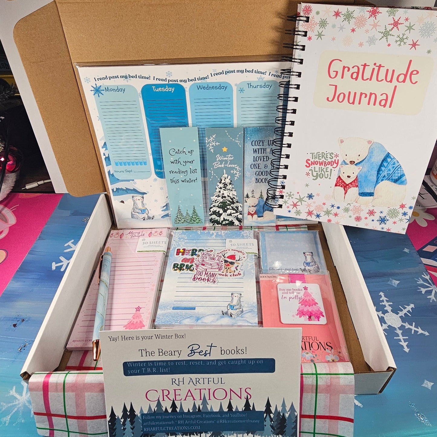 Open Winter Book Lovers Box with gratitude journal, weekly planner pad, notepads, pen, stickers, bookmarks and magnet
