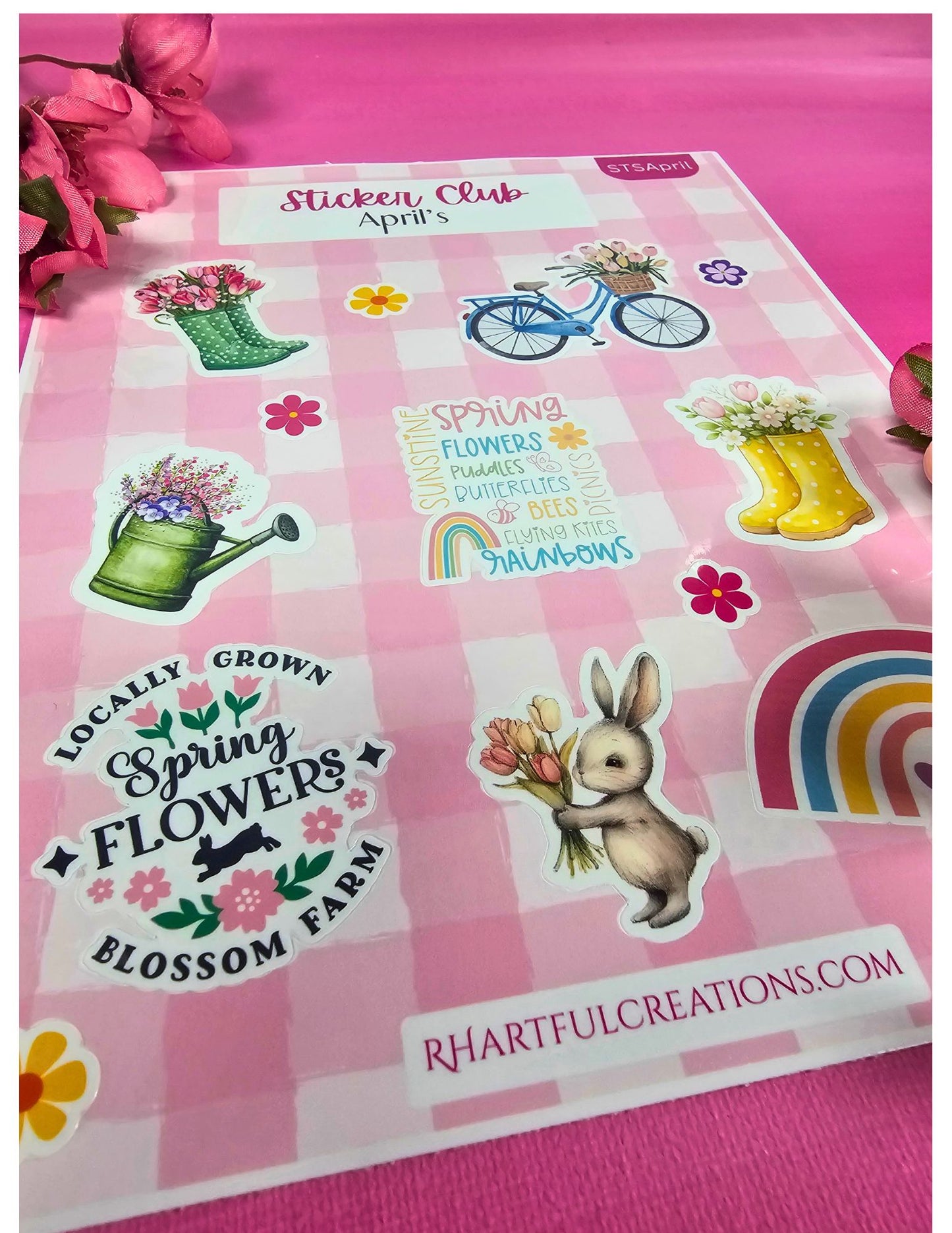 Sheet of spring-themed stickers with various illustrations on a pink background.
