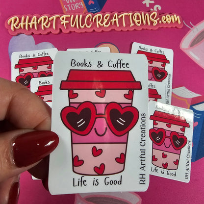 Handmade “Books & Coffee – Life is Good” sticker featuring a pink coffee cup with heart sunglasses and red hearts, created by RH Artful Creations.