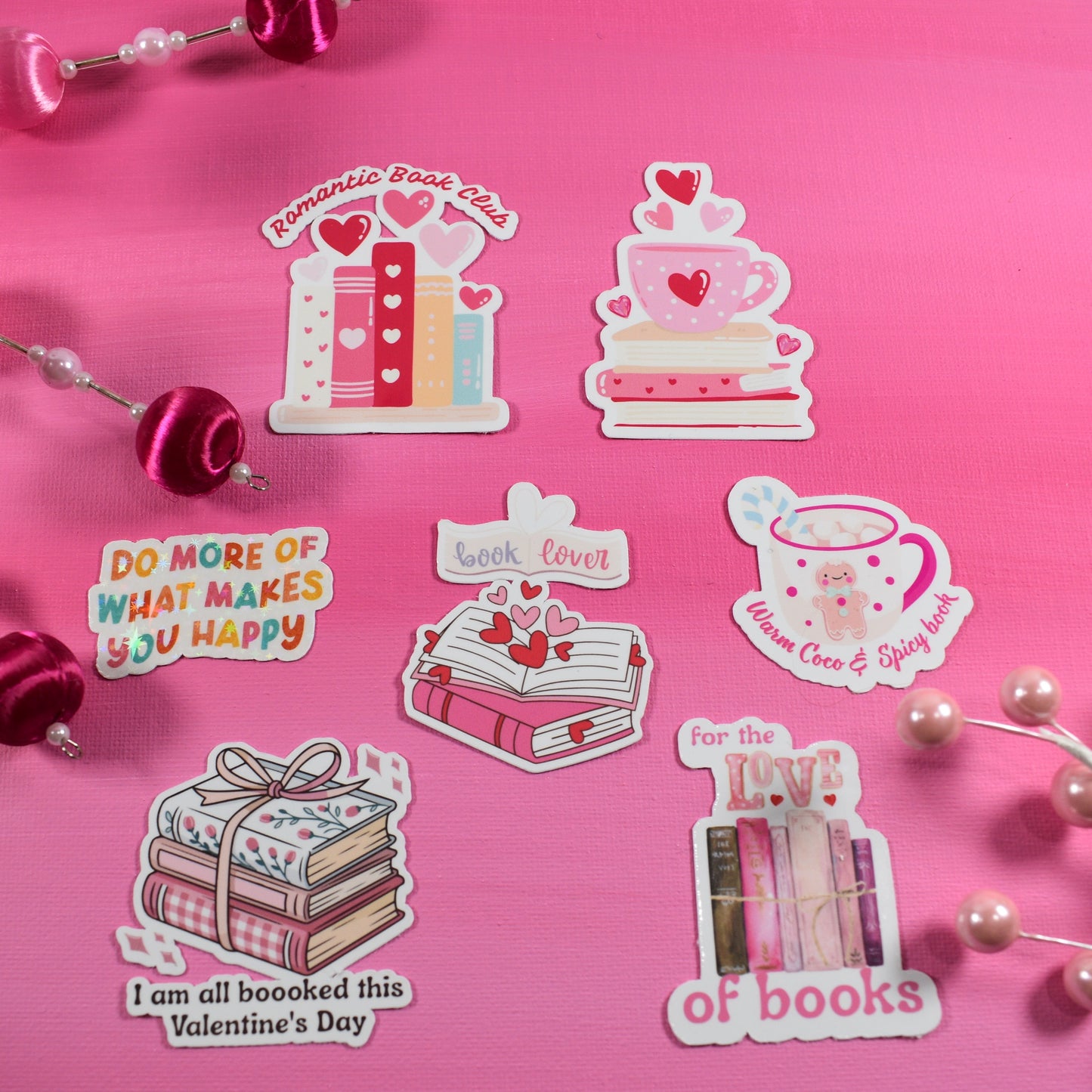 Set of Valentine's Day-themed stickers on a pink background with decorative elements.