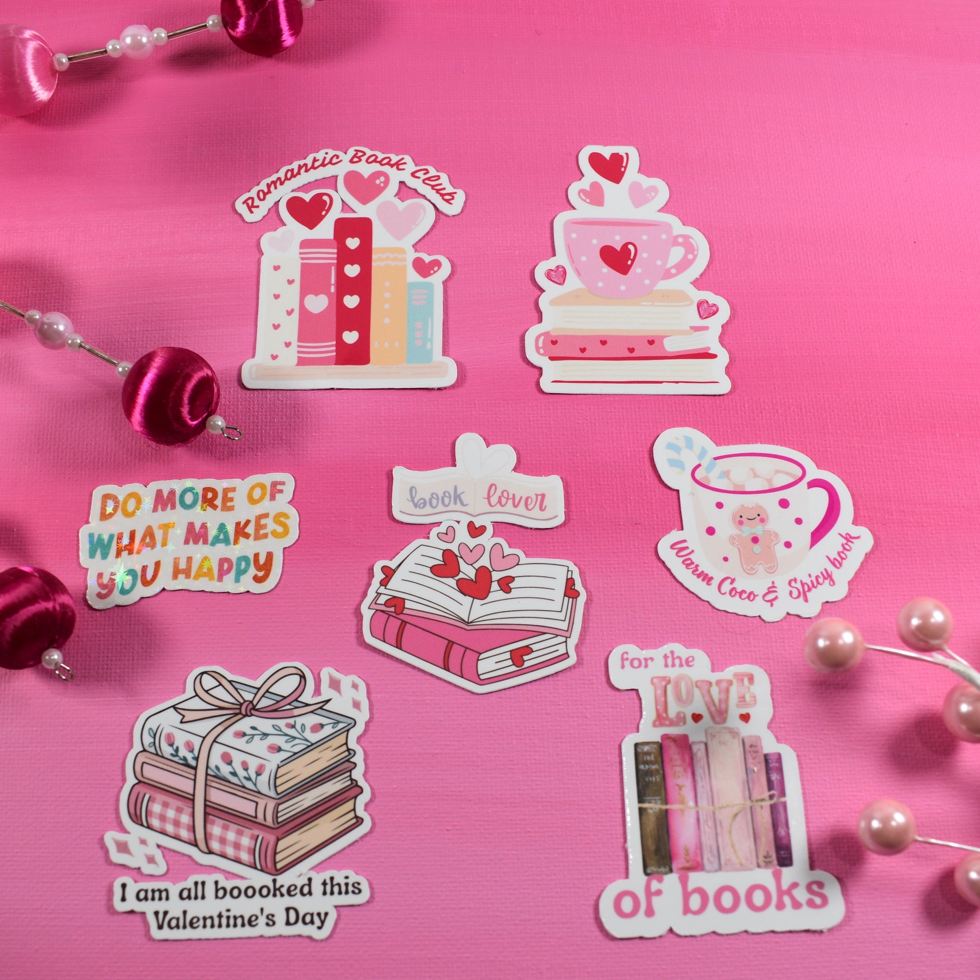 Set of Valentine's Day-themed stickers on a pink background with decorative elements.