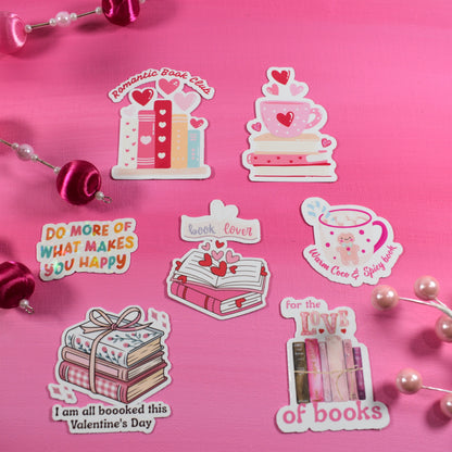 Set of Valentine's Day-themed stickers on a pink background with decorative elements.