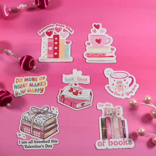 Set of Valentine's Day-themed stickers on a pink background with decorative elements.