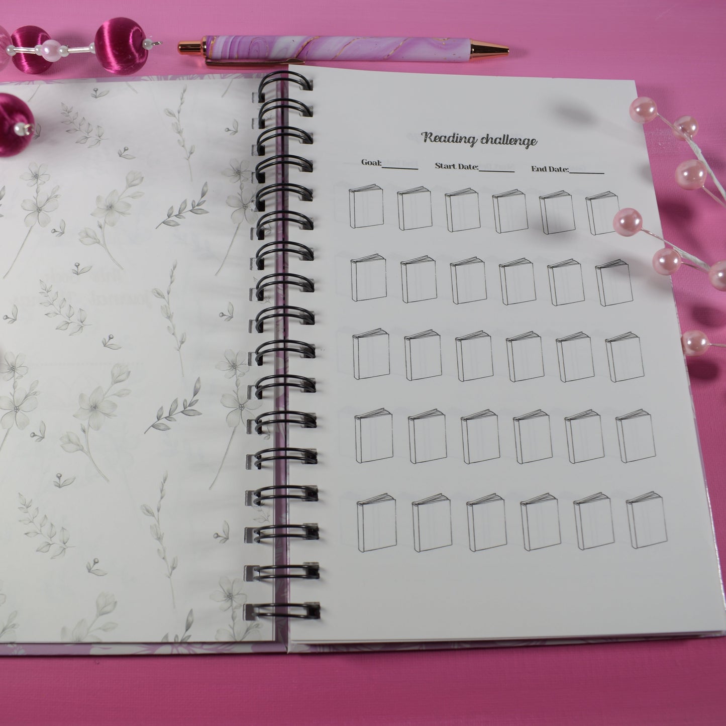 Notebook with drawing challenge on pink surface