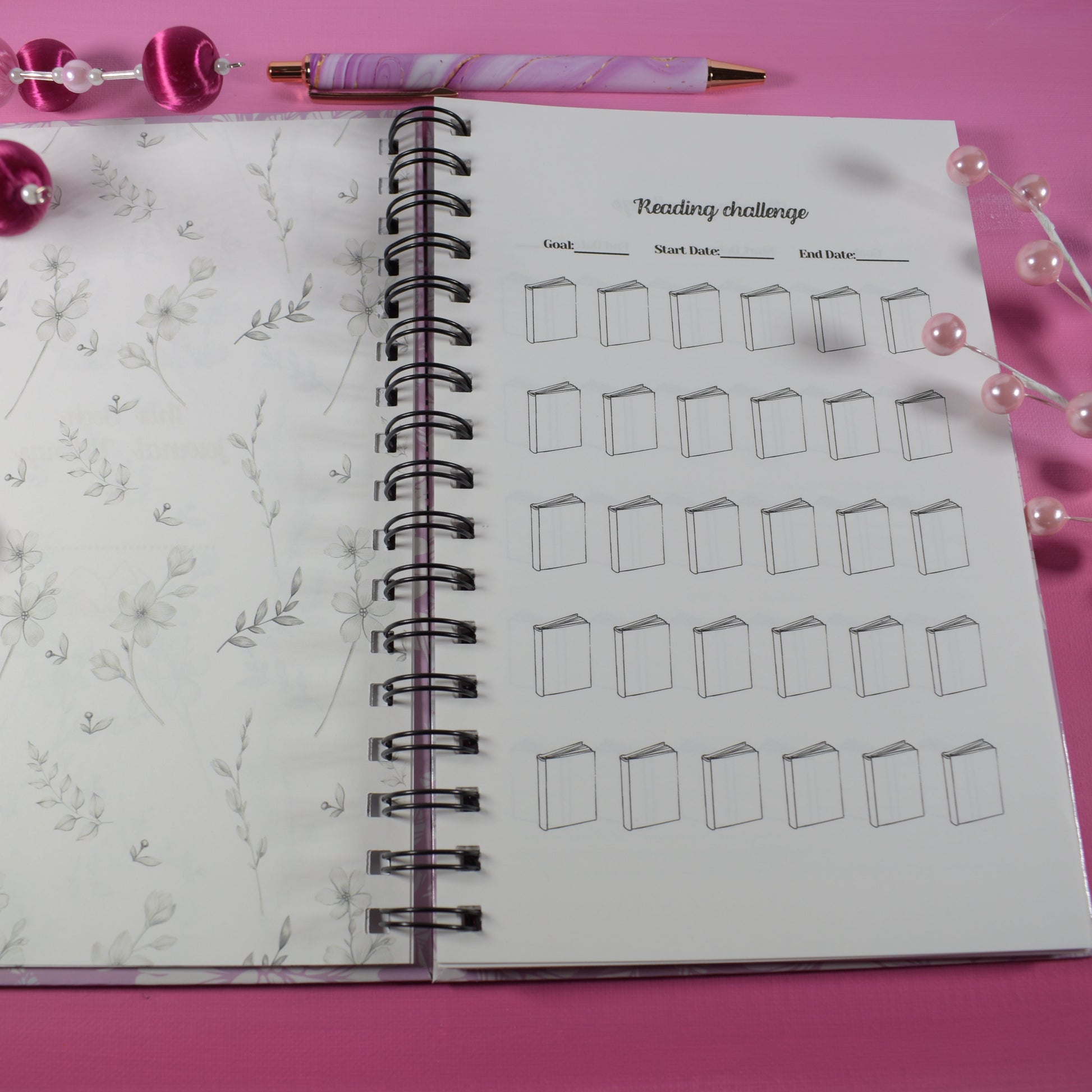 Notebook with drawing challenge on pink surface