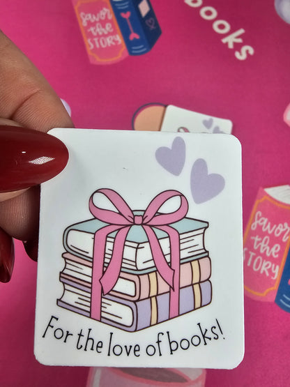 Card with book illustration and 'For the love of books!' text held against a pink background with text and graphics.