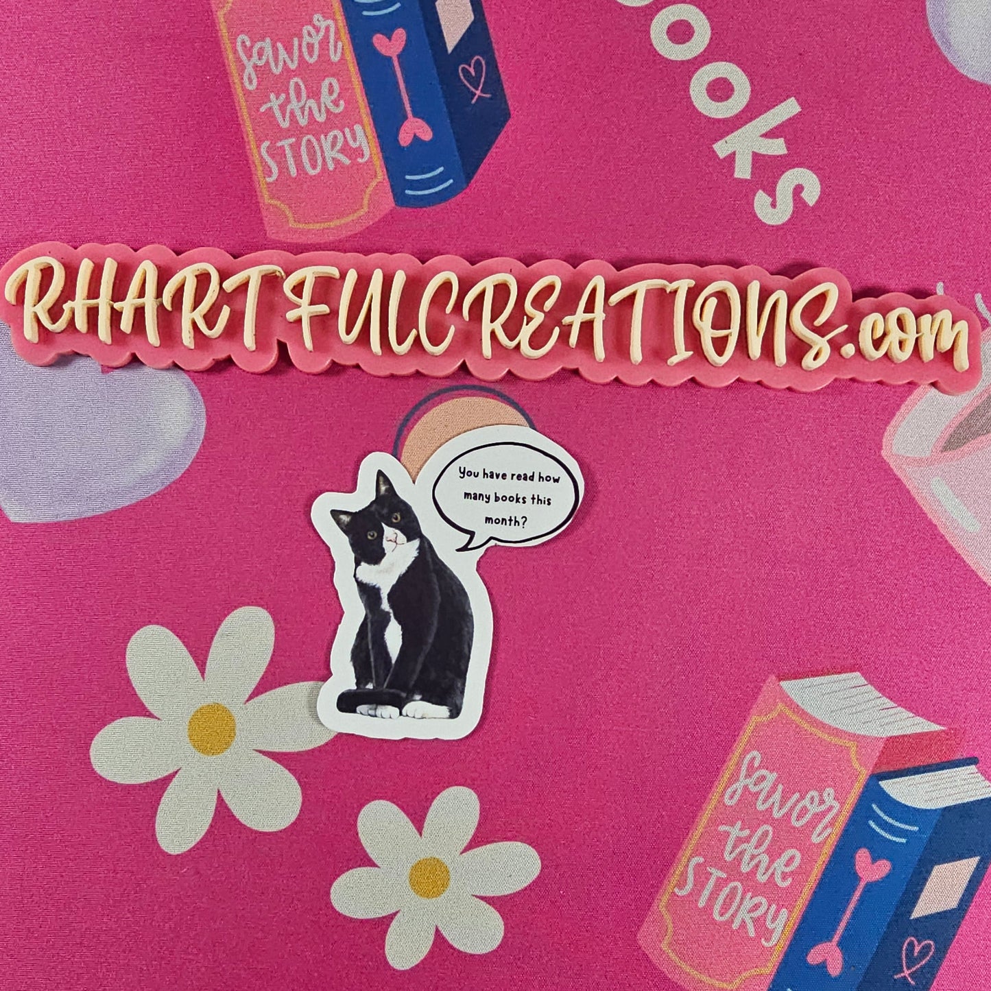 Sticker of a black-and-white cat with speech bubble saying “You have read how many books this month?” handmade book lover  sticker