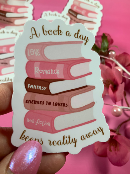 Sticker with book stack design and text on a pink background
