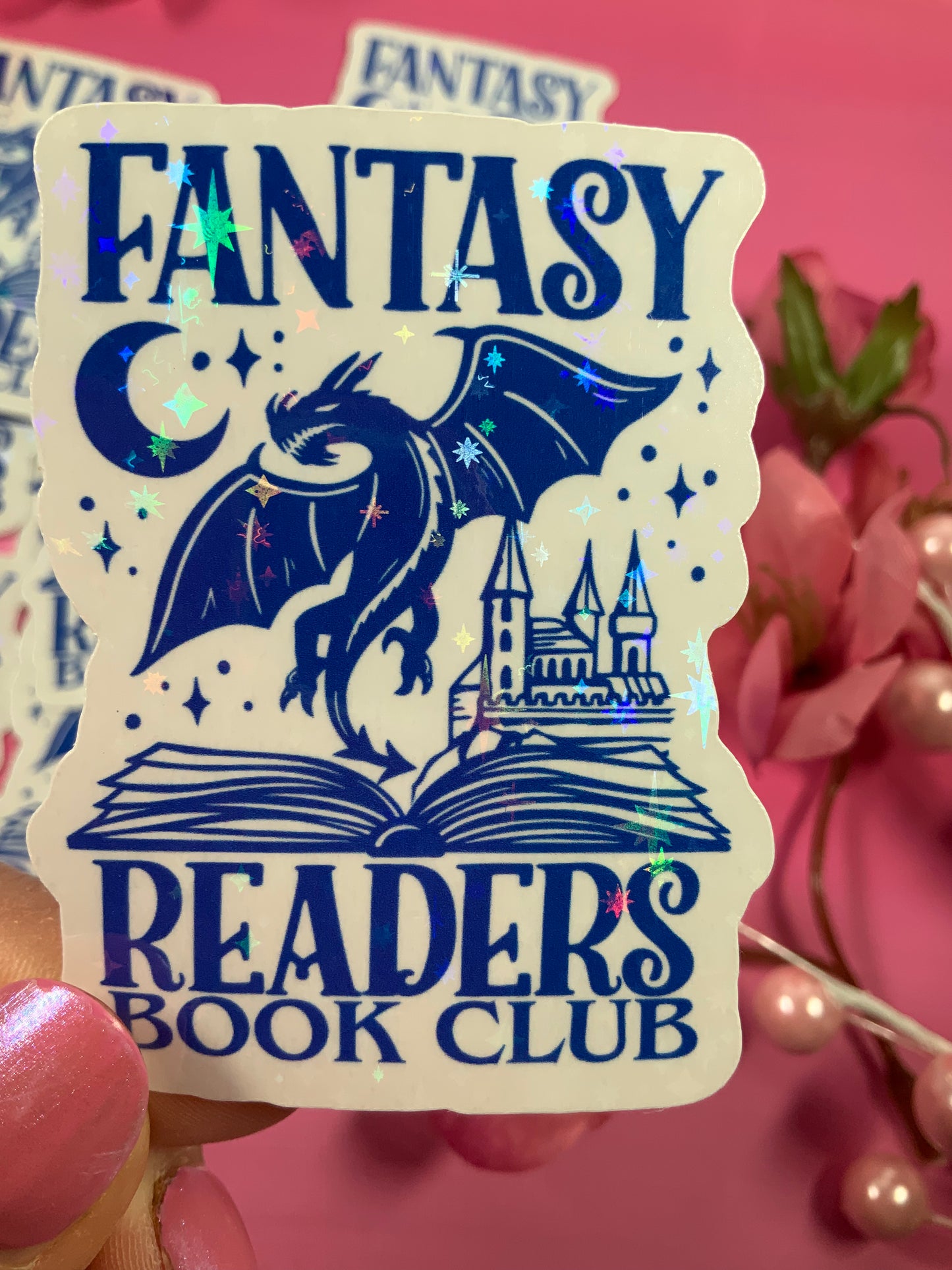 Sticker with 'Fantasy Readers Book Club' design featuring a dragon, castle, and open book on a pink background.