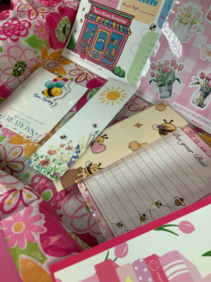 Collection of colorful stationery items with floral and cartoon designs.
