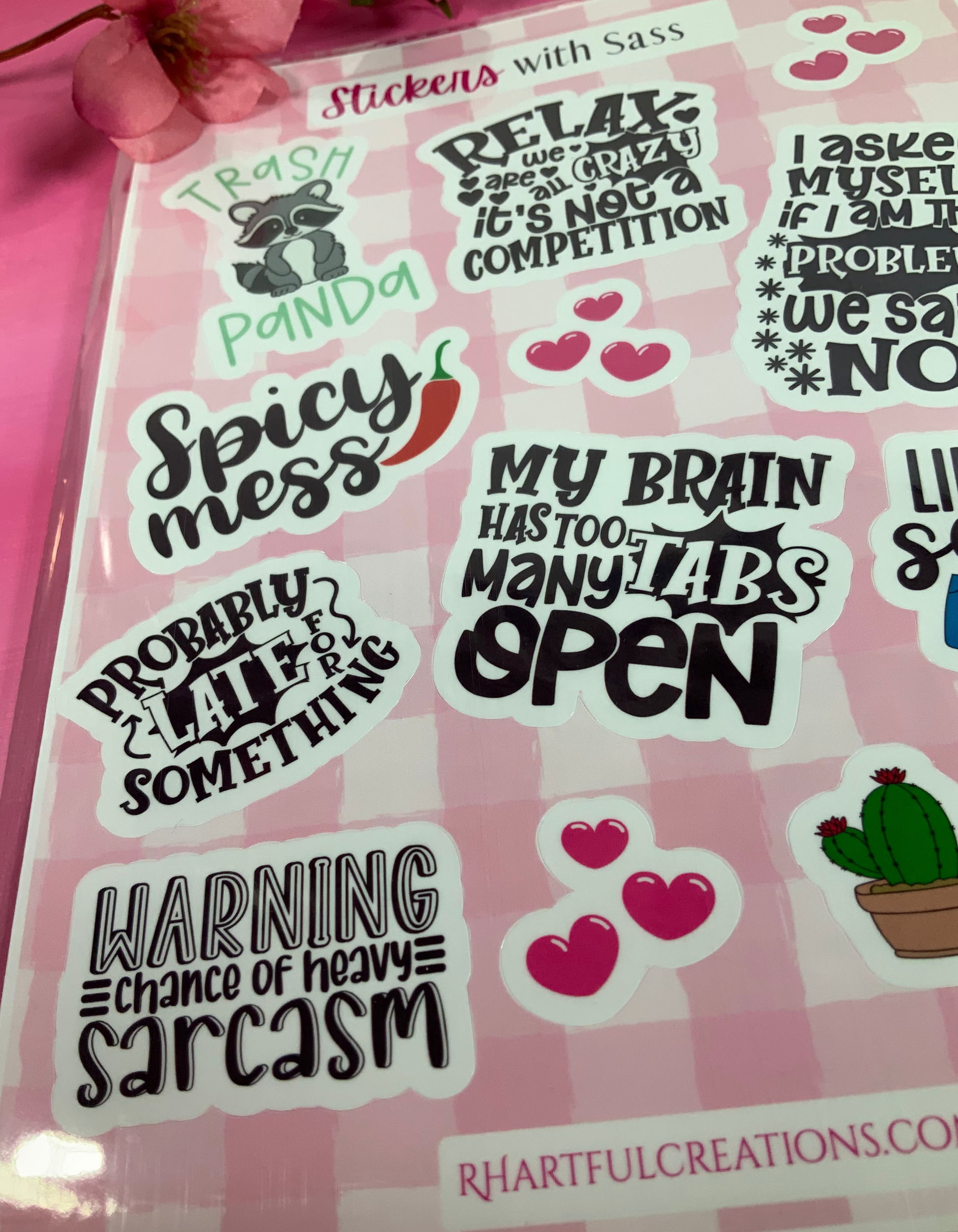 Sheet of humorous stickers with text and graphics on a pink background