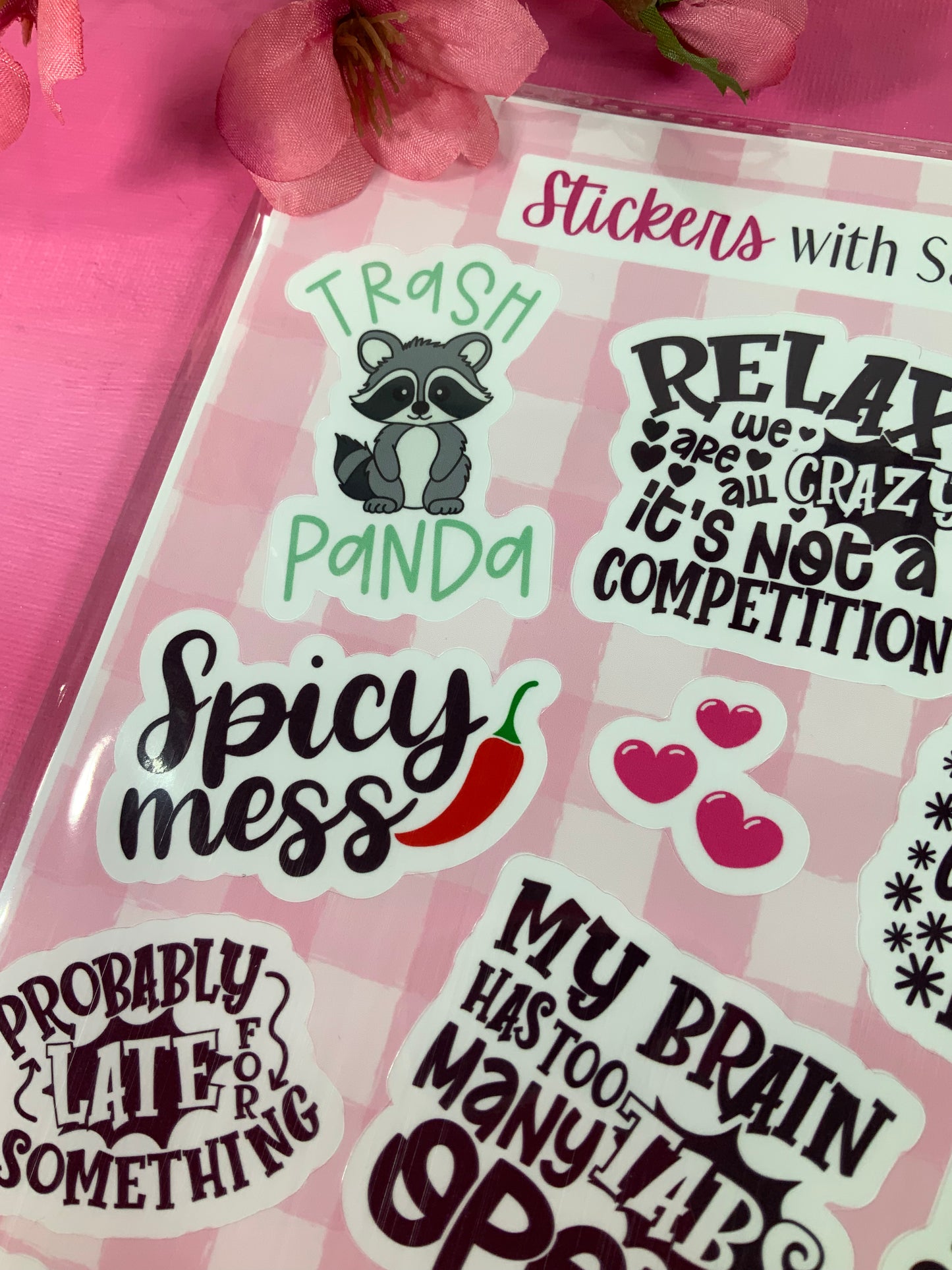 Pack of stickers with humorous designs on a pink background
