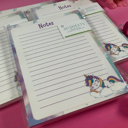 Notebook with unicorn design on a pink surface