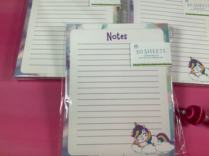 Notepad with unicorn design and 'Notes' text on a pink surface