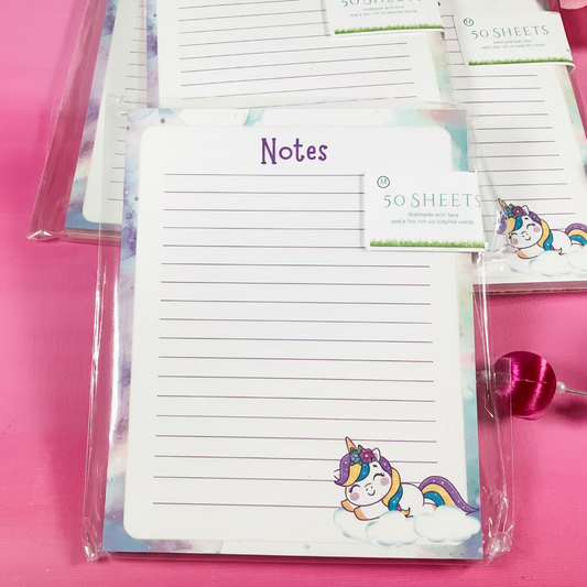 Notebook with unicorn design on a pink background