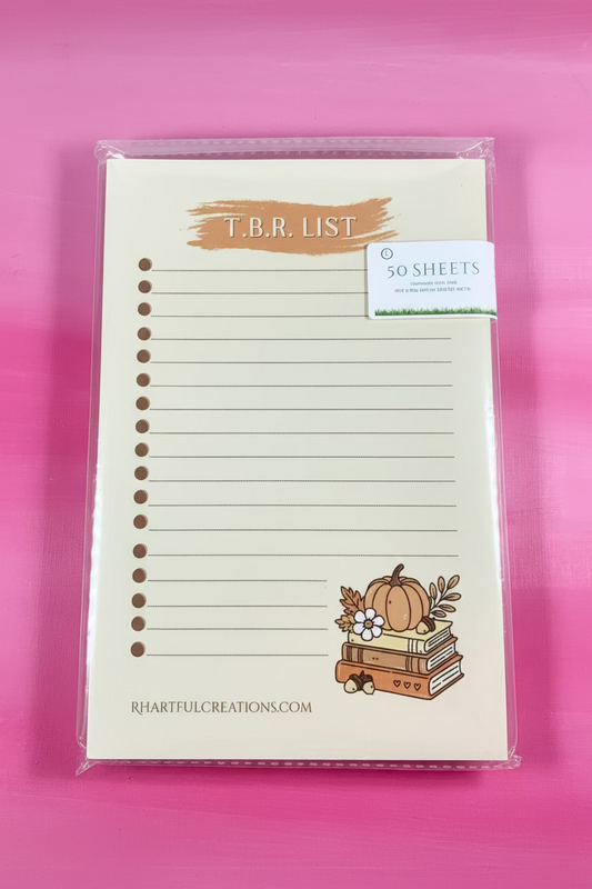 Notepad with a pumpkin design on a pink background