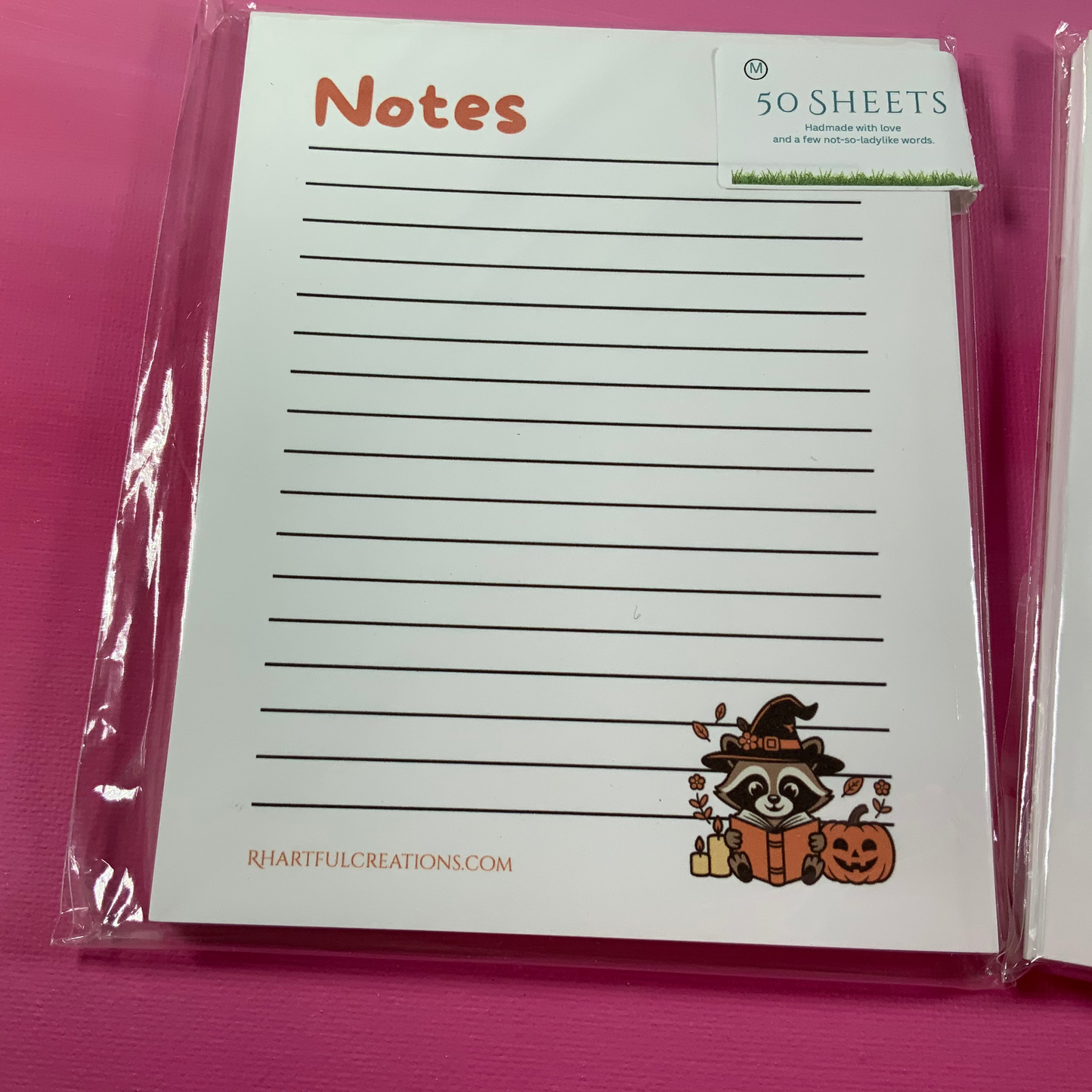 Notebook with Halloween design on a pink background