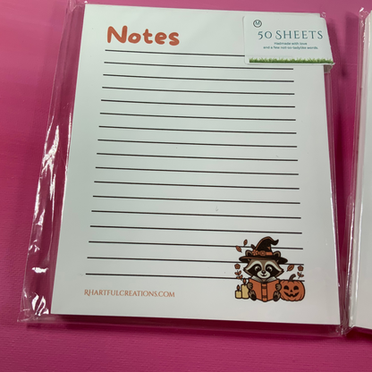 Notebook with Halloween design on a pink background