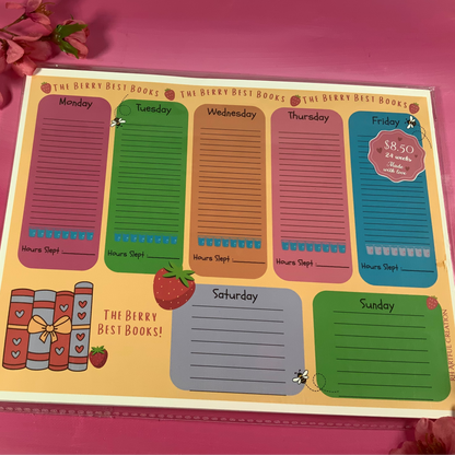 Weekly planner with colorful days of the week on a pink surface