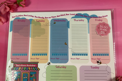 Weekly planner with colorful days of the week on a pink background