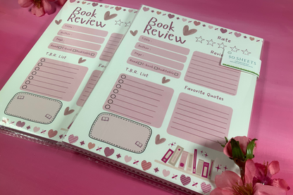 Book review sheet with heart designs on a pink background