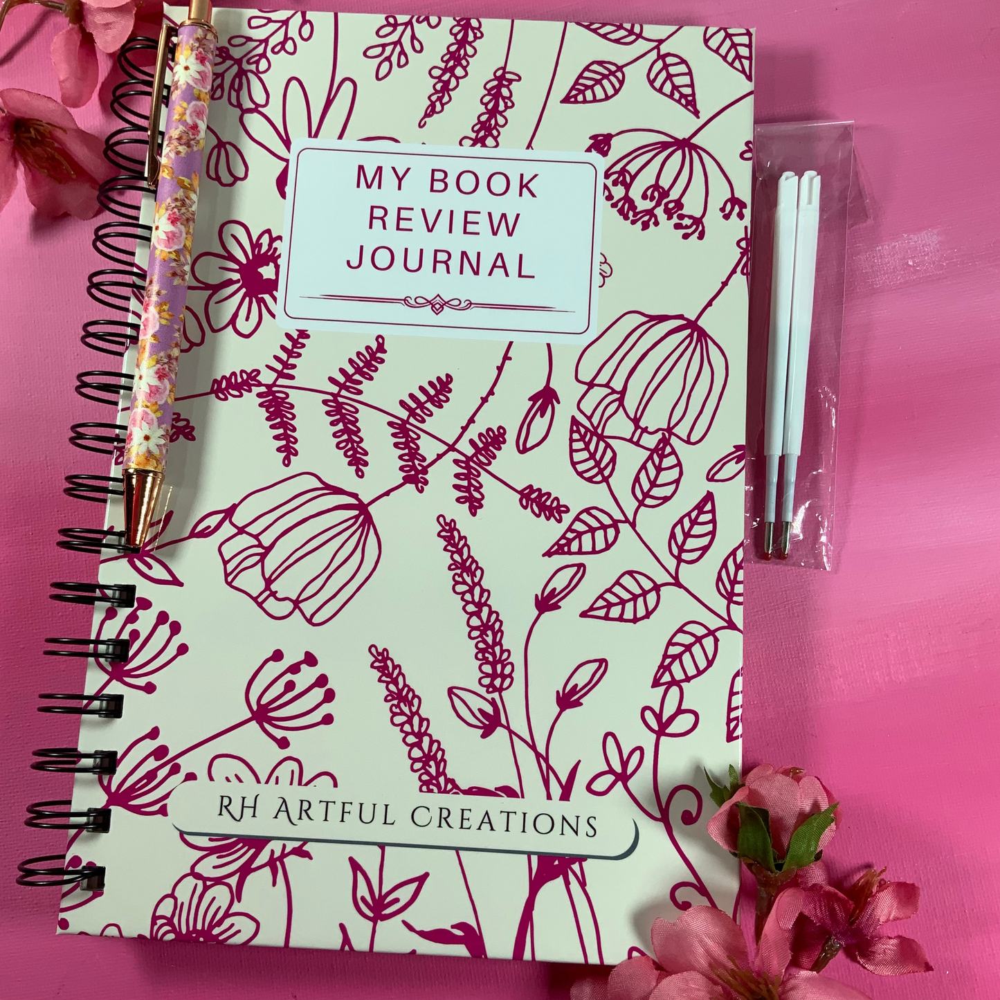 Book Review Journal with floral design on a pink background