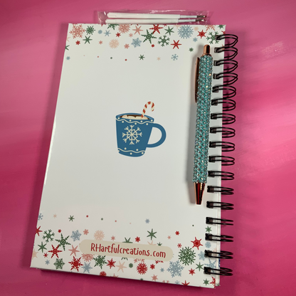 Notebook with a festive design on a pink background
