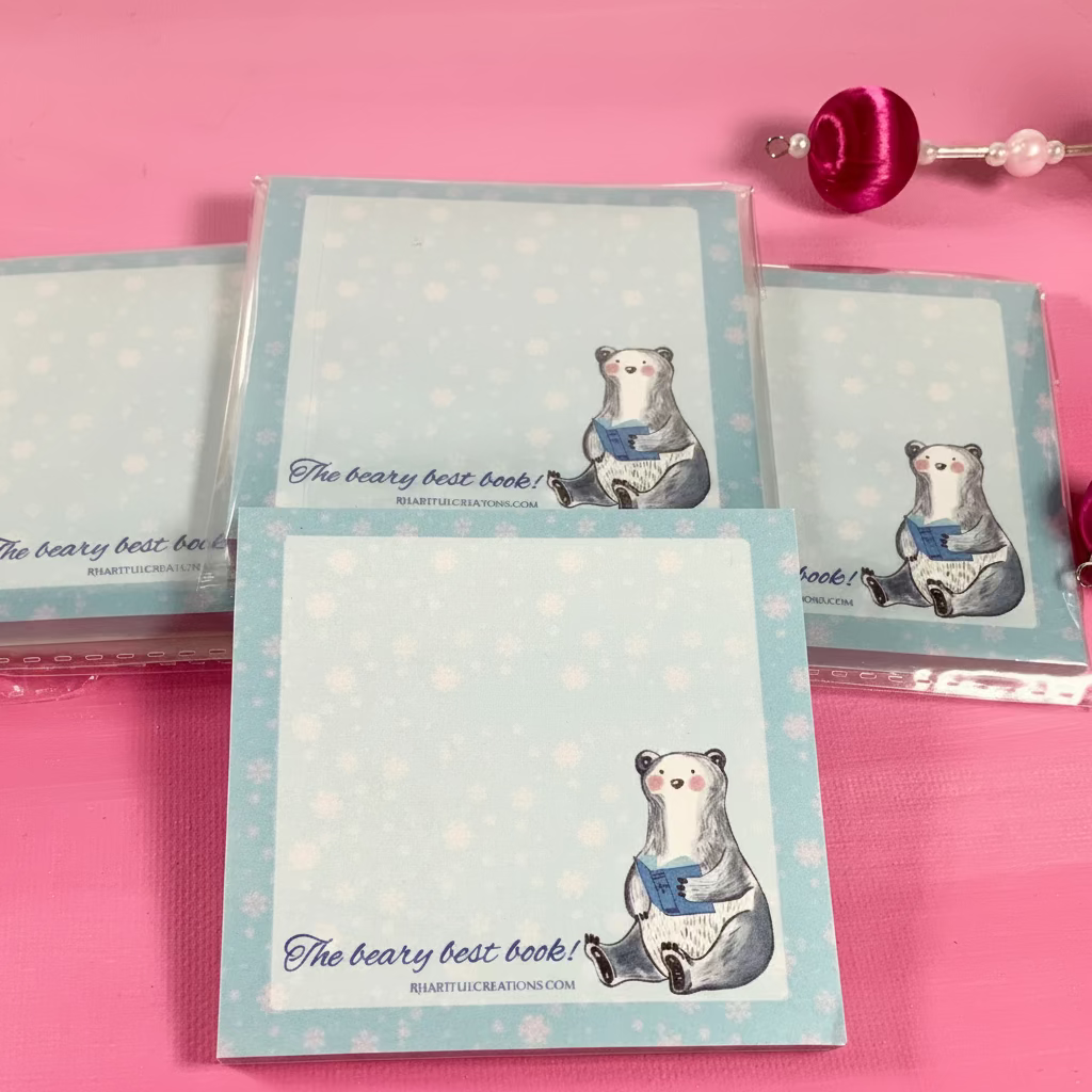 Notebooks with bear illustrations on a pink surface