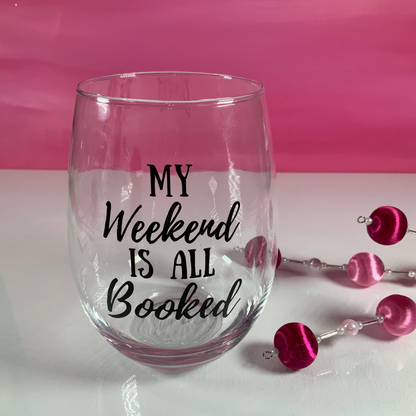 Clear glass with 'My Weekend is All Booked' text on a pink background
