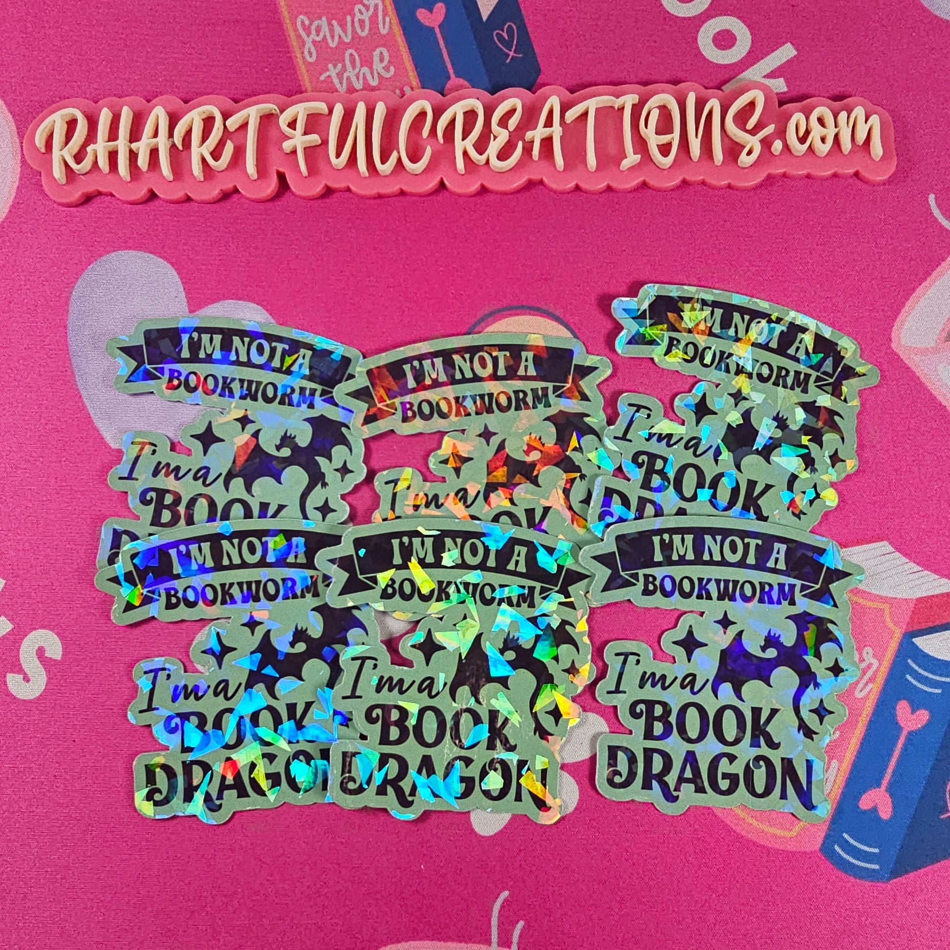 “I’m Not a Bookworm, I’m a Book Dragon” holographic vinyl sticker with rainbow sparkle finish, handmade by RH Artful Creations.