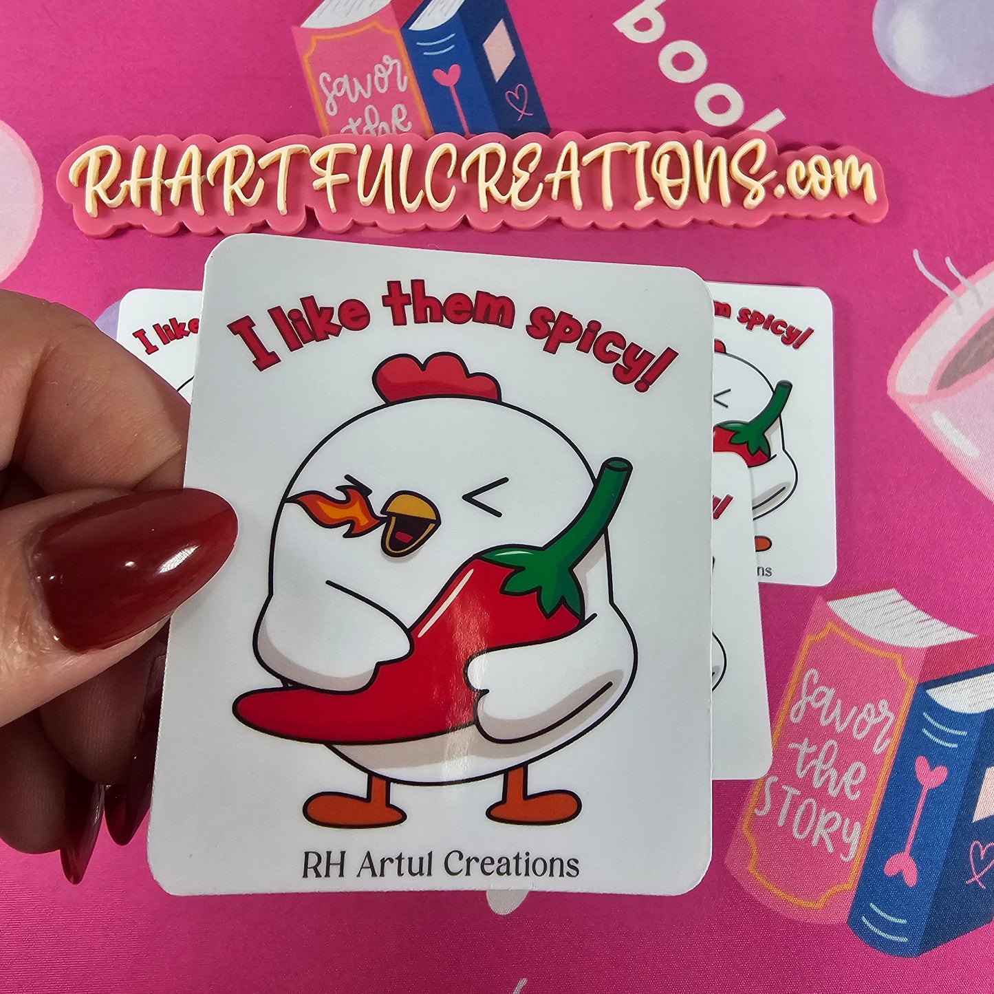 “I Like Them Spicy” chicken sticker by RH Artful Creations, cute cartoon chicken hugging a red chili pepper with a tiny flame