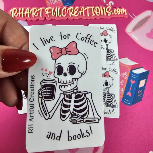 Sticker featuring a cute skeleton with a pink bow holding coffee and the quote “I live for coffee and books!” Handmade by RH Artful Creations on a pink book-themed background.