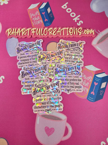Holographic stickers with text on a pink background with book illustrations
