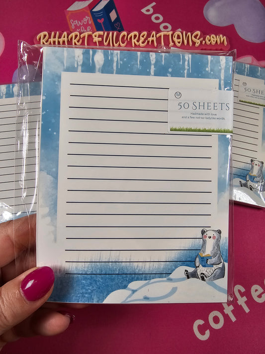 Handmade winter notepad with lined pages and an illustration of a cute polar bear reading a book while sitting on snowy ice, 50 sheets.