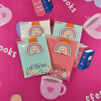 Colorful stationery items on a pink background with 'books' text.