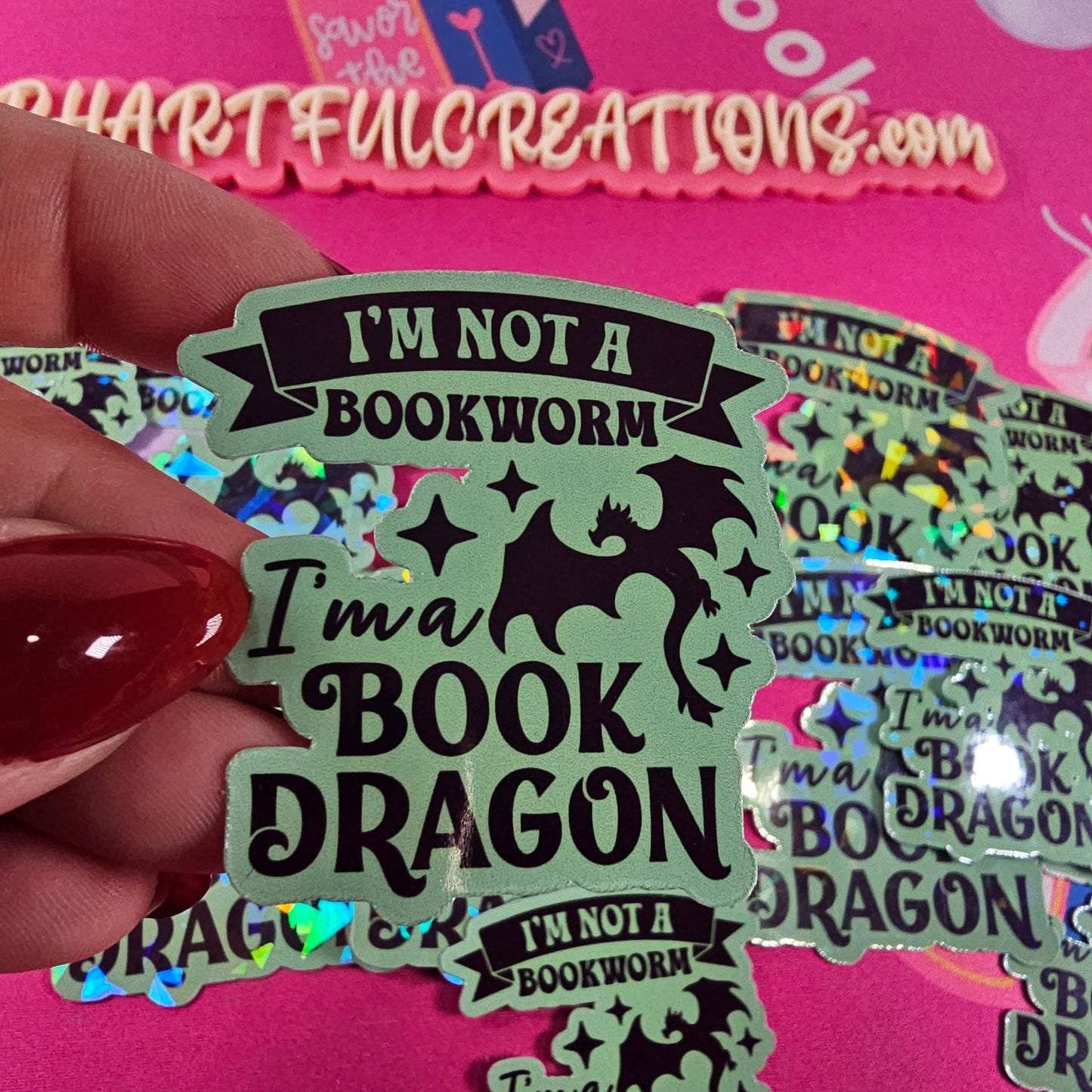 “I’m Not a Bookworm, I’m a Book Dragon” sticker with rainbow sparkle finish, handmade by RH Artful Creations.
