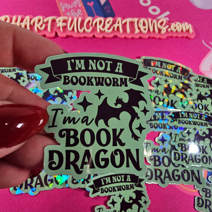 “I’m Not a Bookworm, I’m a Book Dragon” sticker with rainbow sparkle finish, handmade by RH Artful Creations.