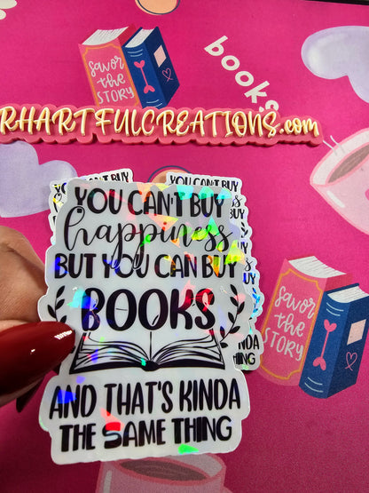 Sticker with book-themed text held over a pink background with 'Rhartful Creations' branding.