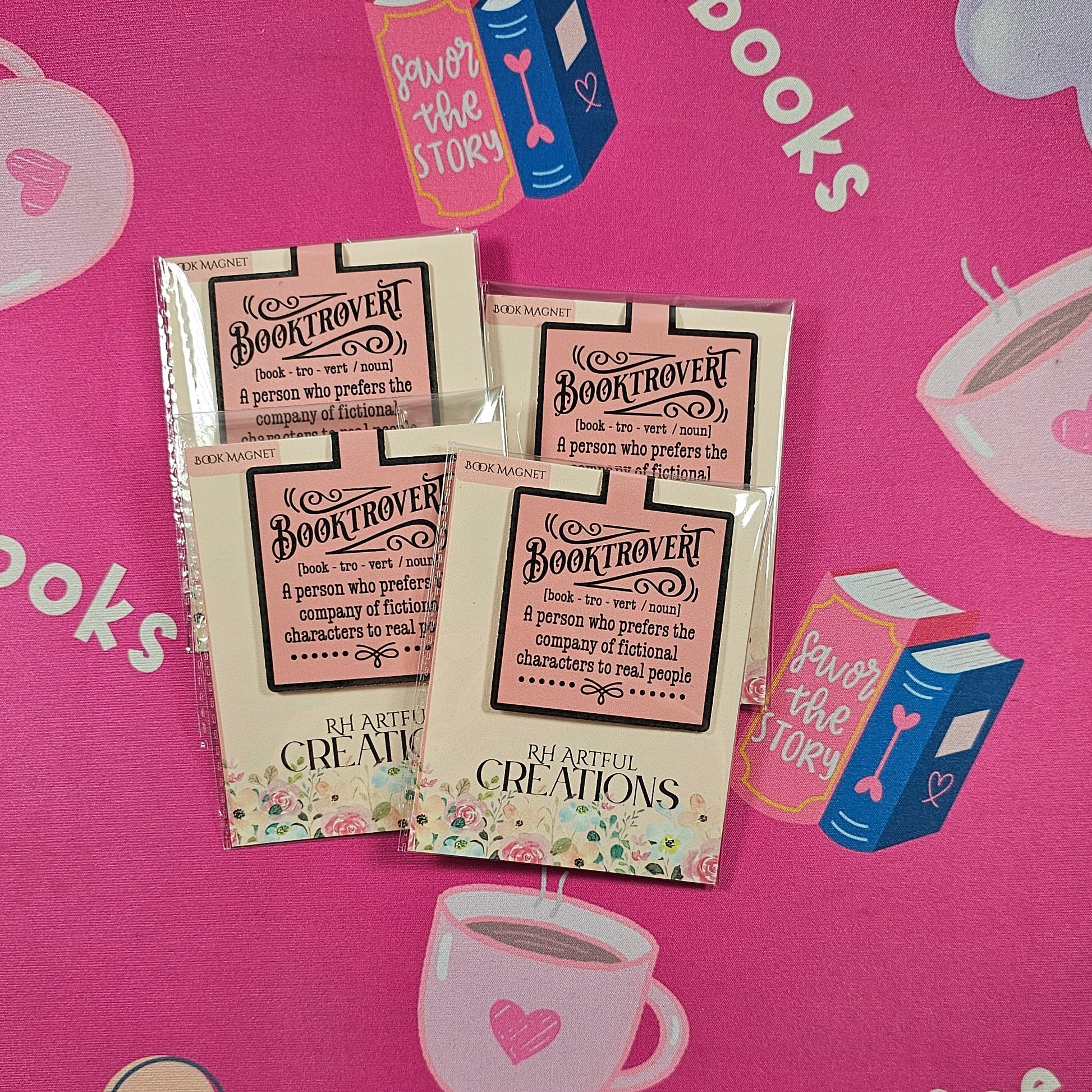 Packets of coffee on a pink mat with coffee-themed designs